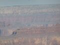 A Huey (UH-1) park helicopter working it's way the 1 mile climb out of the canyon