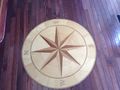 Matching compass rose inlaid in wood floor