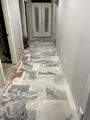 Basement hallway tile nearing completion